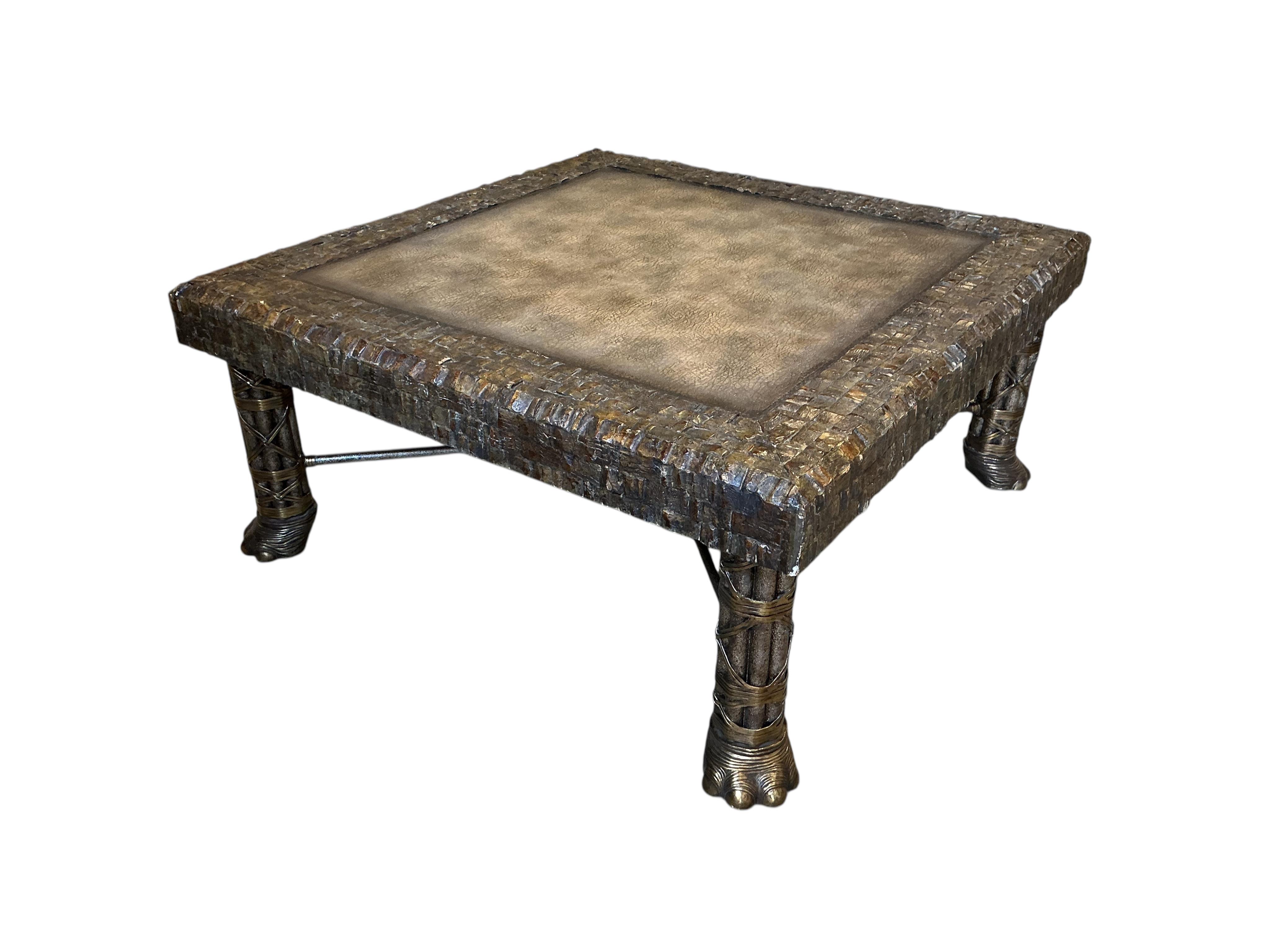 A Contemporary Maitland Smith square brass, leather top coffee table on cluster column, elephant foot supports, 108cm, height 48cm
